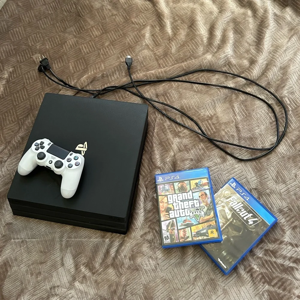 PS4 Pro + Controller + Power Cord + HDMI Cord + 2 Games
